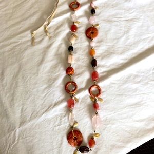 Multi textured statement necklace in corals, wood and gold by Lee Angel NYC.